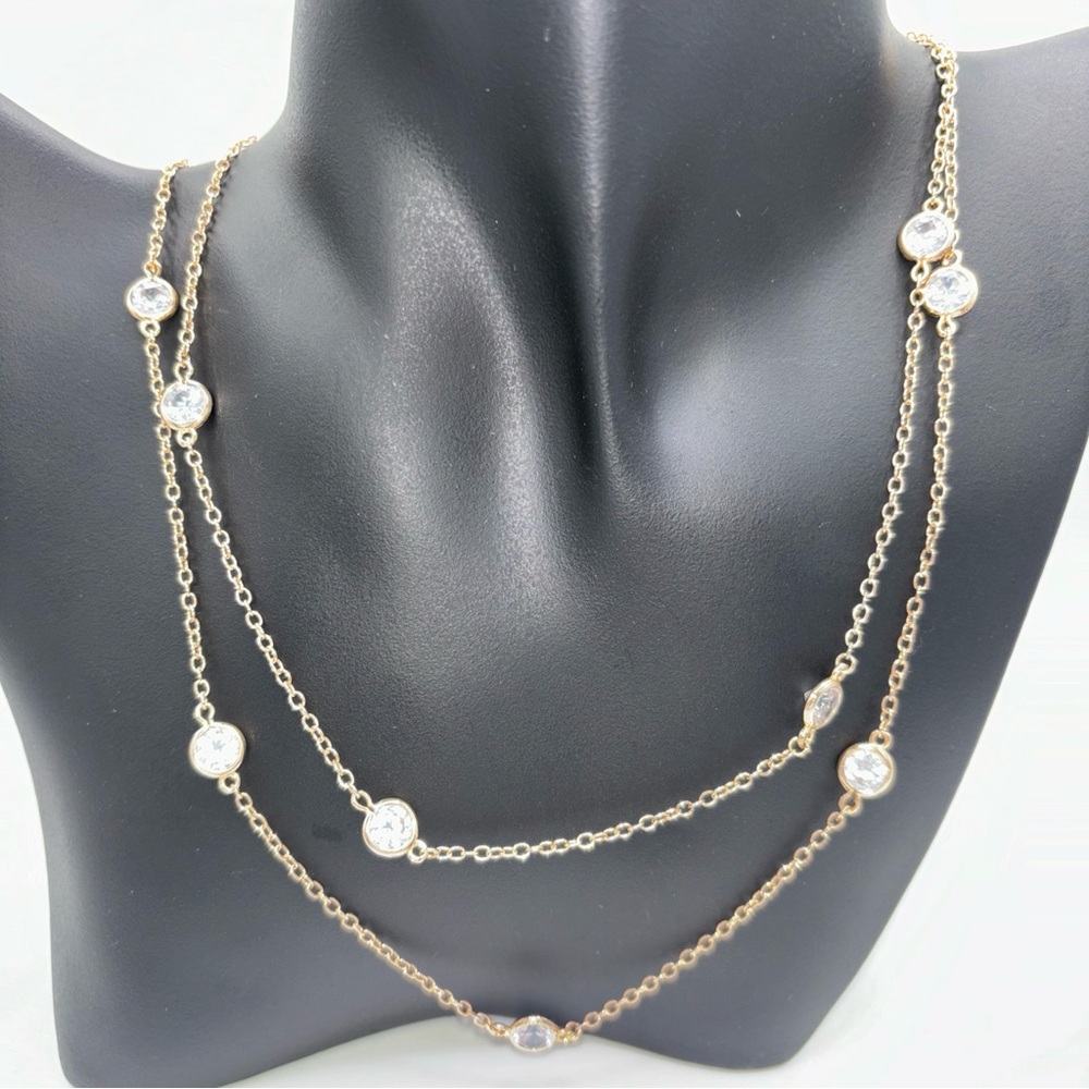 CZ by Kenneth Jay Lane, long adj. gold toned chain with 13 CZ crystals, Signed